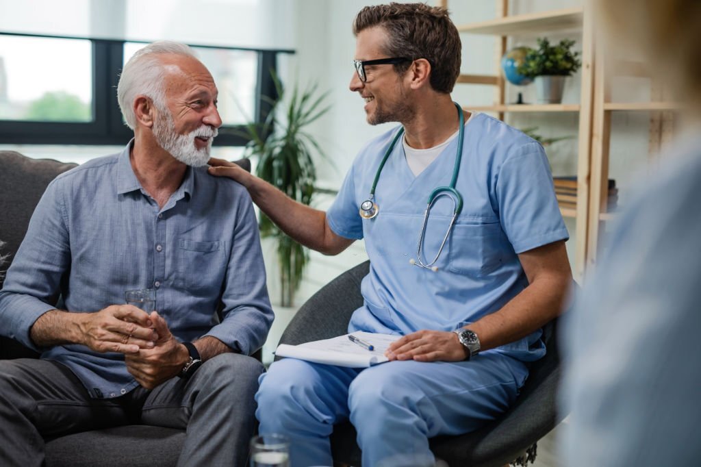 Male medical doctor with old patient